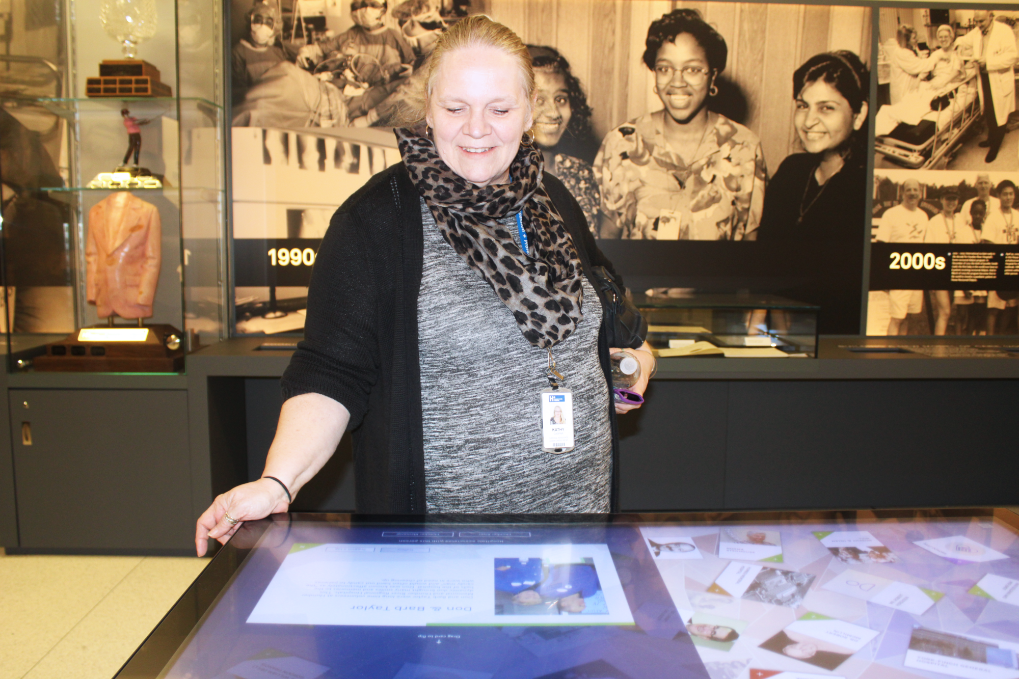 Kathy looks at her parent's profile in the Heritage Centre