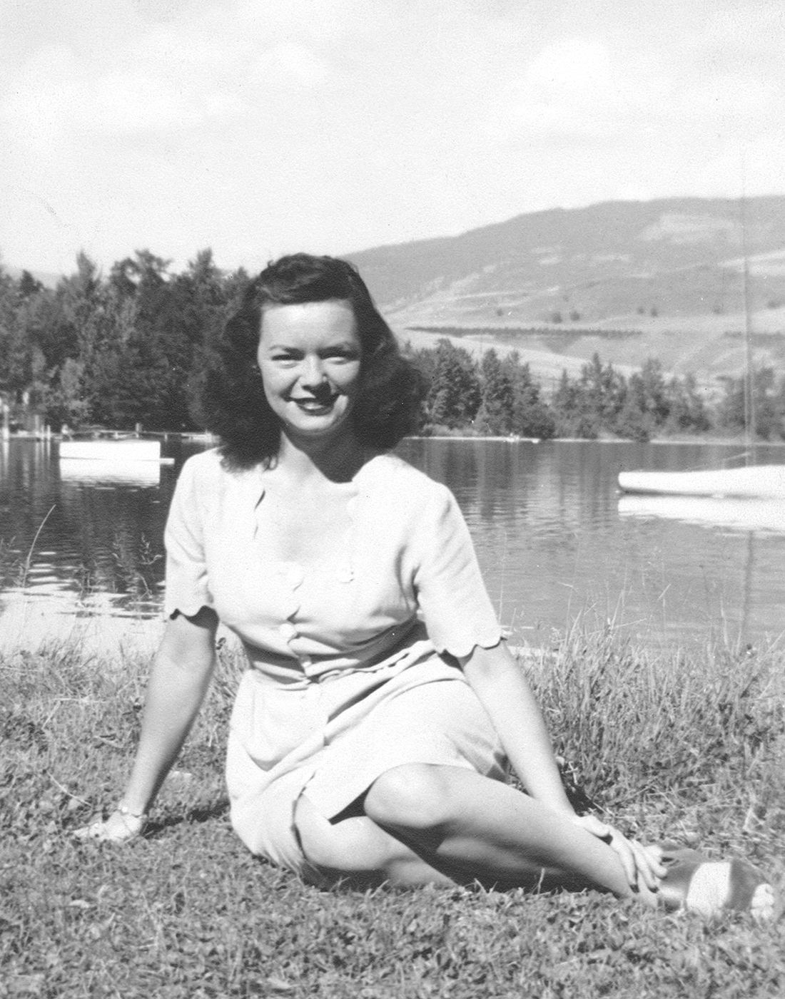 a young audrey sitting in a field