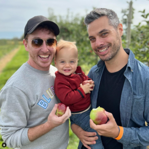 Baby Sawyer with his dads